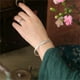 thumbnail image 5 of Pulsera rígida con flores para hombre y mujer, ajustable, tipo brazalete, ideal como regalo de cumpleaños., 5 of 9