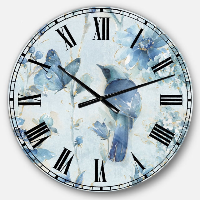 DesignArt Indigold Watercolor Flower III Large Wall Clock, an oversized round wall clock made of glossy aluminum. The clock face features a vibrant watercolor design of blue flowers and a bird, complemented by bold black Roman numerals. Includes a 1-inch mounting frame for a floating artwork effect and arrives ready to hang with mounting brackets and instructions. Ideal for home or office décor.