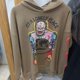 thumbnail image 3 of Sudadera con capucha de gran tamaño marrón de Kanye West para hombre y mujer, ropa de calle, sudaderas de hip hop con estampado de calaveras y grafiti, jersey de Stranger Things, 3 of 5