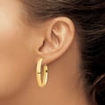 thumbnail image 3 of Primal Gold 14 Karat Yellow Gold 5mm Oval Omega Back Hoop Earrings, 3 of 4