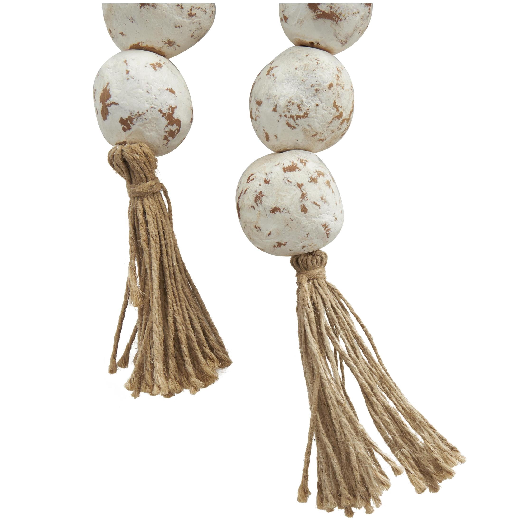 DecMode Handmade Round Intricately Shaped Large Distressed White Ceramic Garland with Tassel
