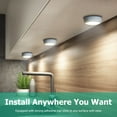 thumbnail image 2 of Pinegreen Lighting Battery-Operated Wireless LED Puck Light, Press-Activated Stick on Light for Closets, Cabinets, Counters, Utility Rooms, Pack of 6 Wood Grain, 2 of 7