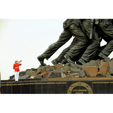The bugler with the US Marine Corps Band playing taps at the Marine Corps War Memorial Arlington Virginia Poster Print by Stocktrek