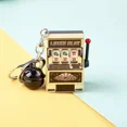 thumbnail image 1 of New Fashion Funny Game Decompression Slot Machine Playing Mini Fruit Handheld Non-toxic Desktop Money Box Kids Toy EntertainingGold+Black BellNosize Gao Jinjia unisex, 1 of 2