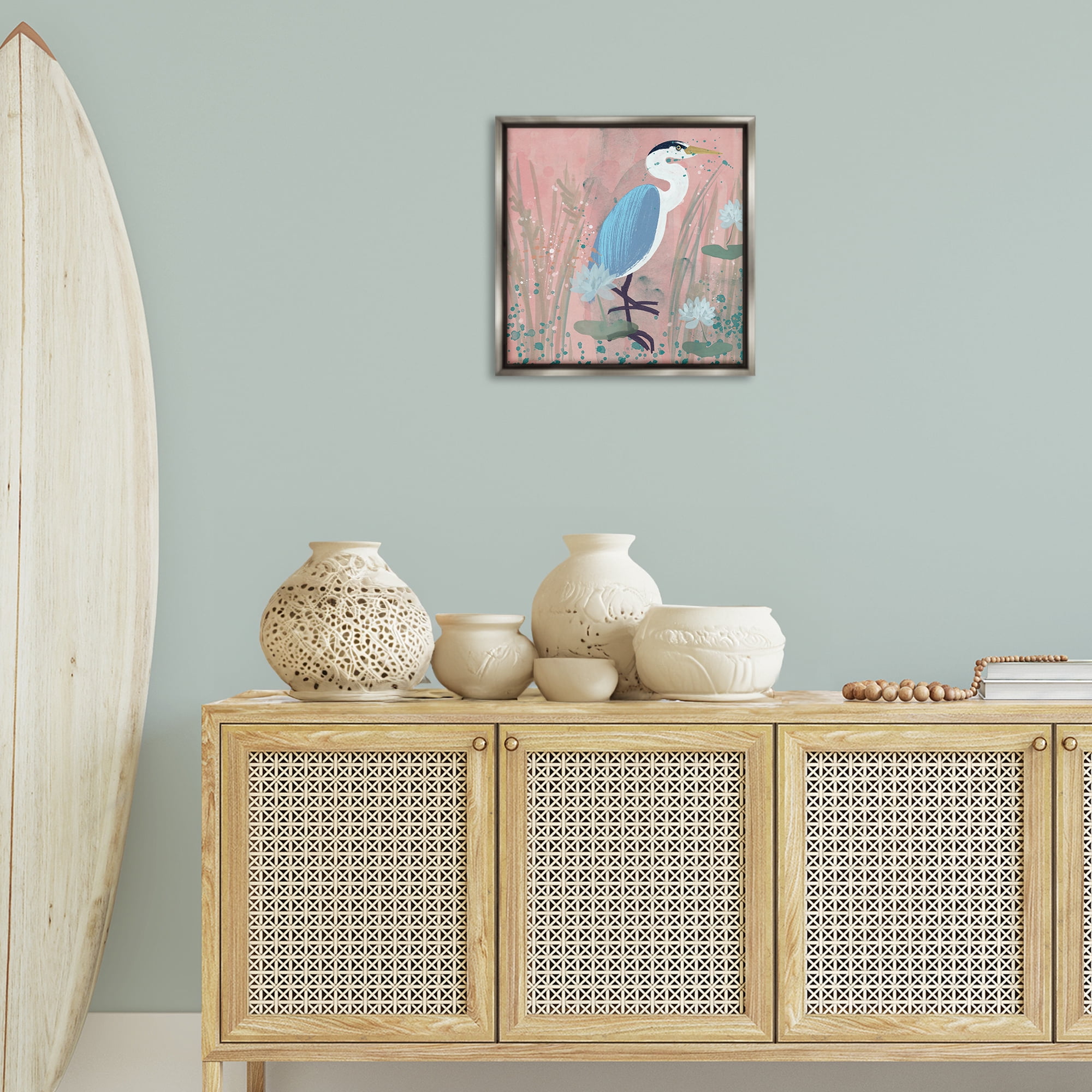 Stupell Industries Coastal Bird with Lotus Flowers Animals & Insects Painting Gray Floater Framed Canvas Art Print Wall Art, 18 x 18