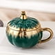 thumbnail image 1 of Taza de Cerámica con Forma de Calabaza, Tapa y Cuchara | Taza de Café Electrochapada de 300 Ml | Regalo Ideal para Halloween | Taza de Desayuno Estilo Europeo En Plata, Verde, Dorado y Verde Menta, 1 of 6