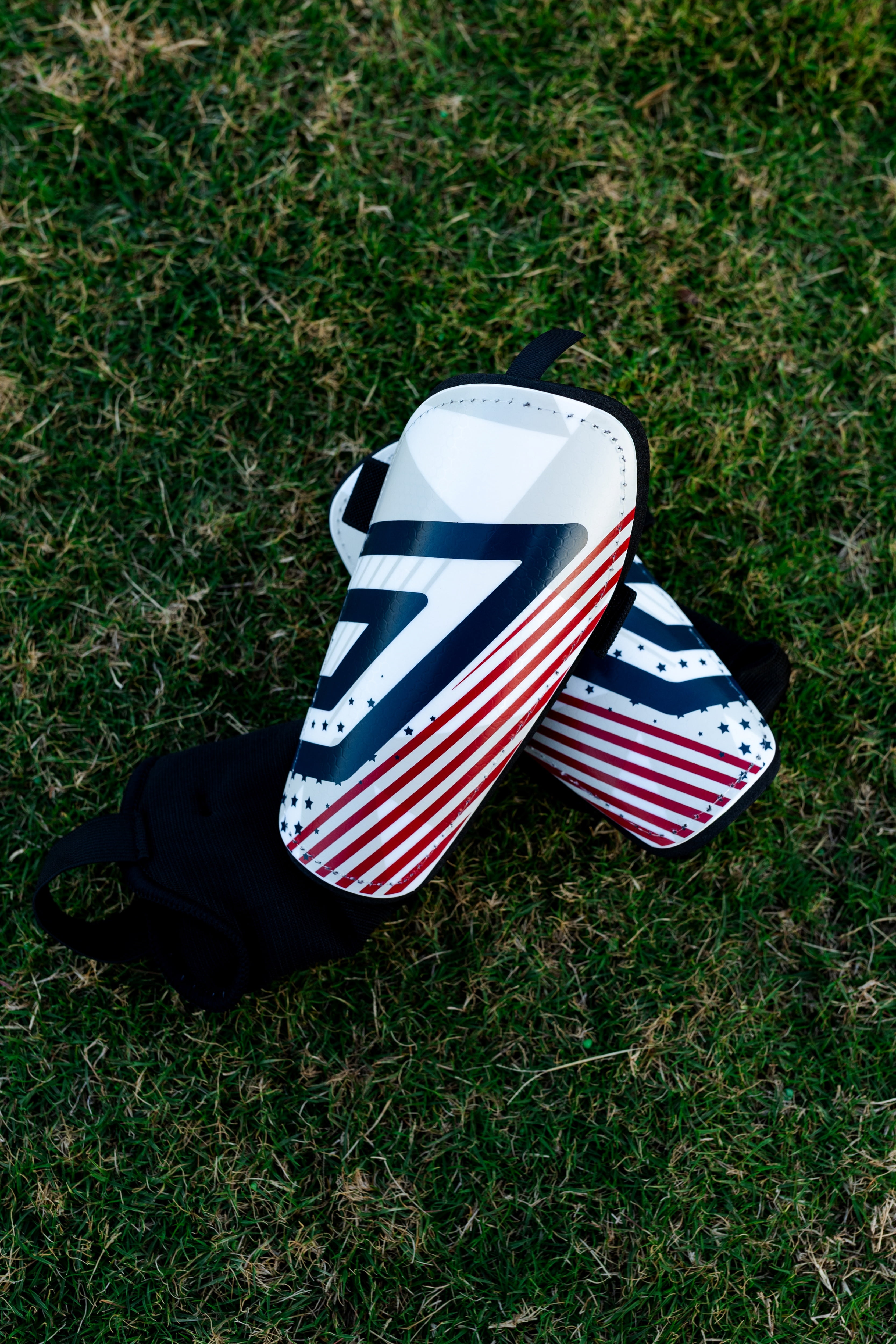 Umbro Americana Youth Small Stirrup Soccer Shin Guards for Kids - Red, White & Blue