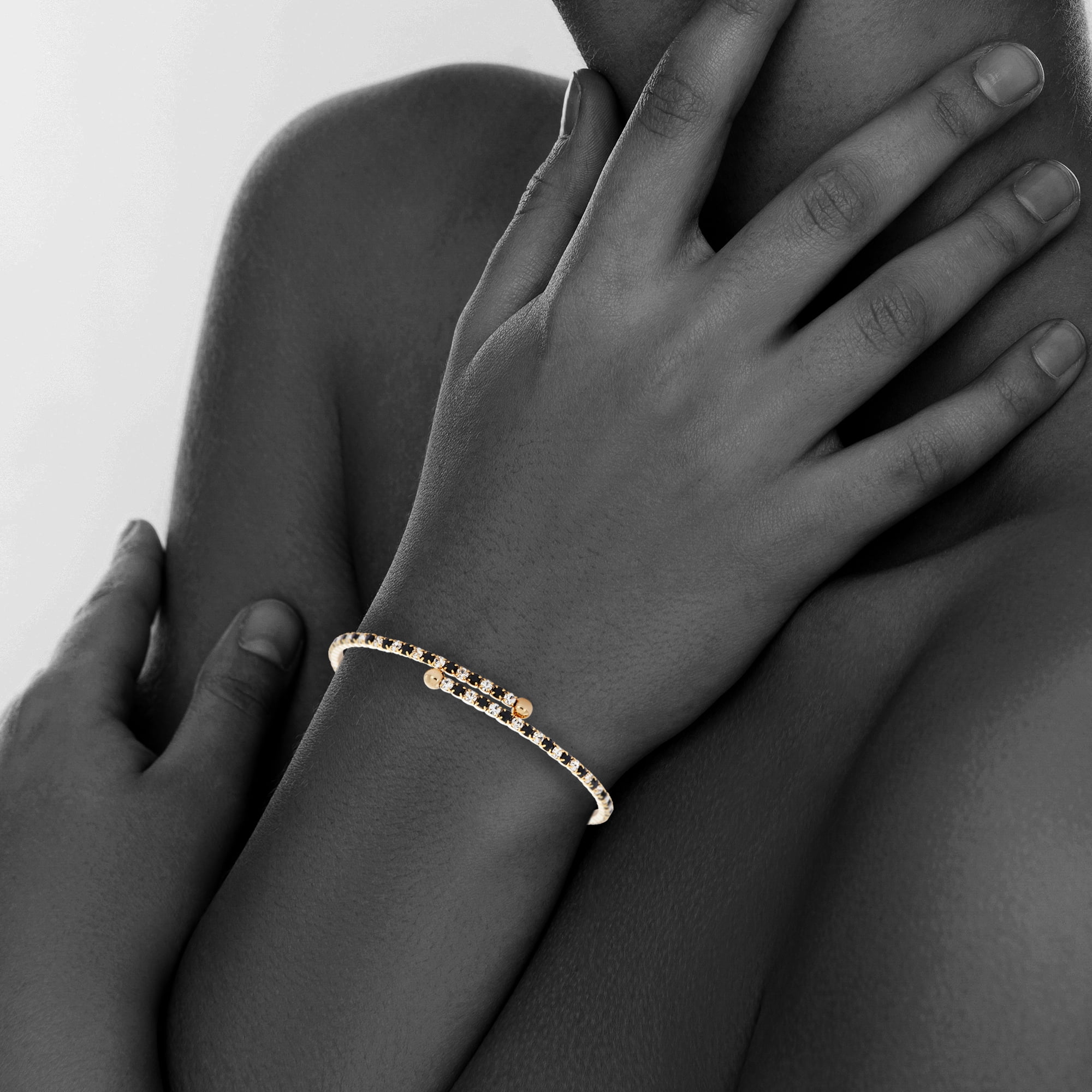 X & O 14KT Gold Plated Crystal Single Row Flex Bangle in Jet and White Crystal Combination