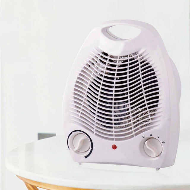 calentador de ventilador eléctrico máquina de calefacción de escritorio, calentador de ventilador doméstico de 1000w/2000w para dormitorio doméstico de invierno. Calentador portátil blanco de 30 x 22 cm con asa superior y rejilla frontal curva; carcasa ABS retardante de llama, dos perillas giratorias en la base para modo y potencia (I 1000 W / II 2000 W) y LED indicador rojo. Vista frontal centrada sobre mesa, diseño compacto para dormitorio o sala de estar; también funciona como ventilador en modo brisa.