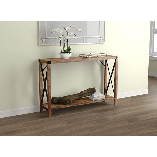 Safdie & Co. Entryway Console Sofa Couch Accent Table 46in L Brown Reclaimed Wood with 1 Shelf and Metal Sides for Living Room, front-facing rectangular console table with brown reclaimed wood top and bottom shelf, black metal open X-frame sides, styled with a white orchid plant in a white pot and a gold tray on top, set against a light beige wall with a decorative mirror, on a wood floor. Suitable for entryway or hallway use and ideal for displaying decor or storing books.
