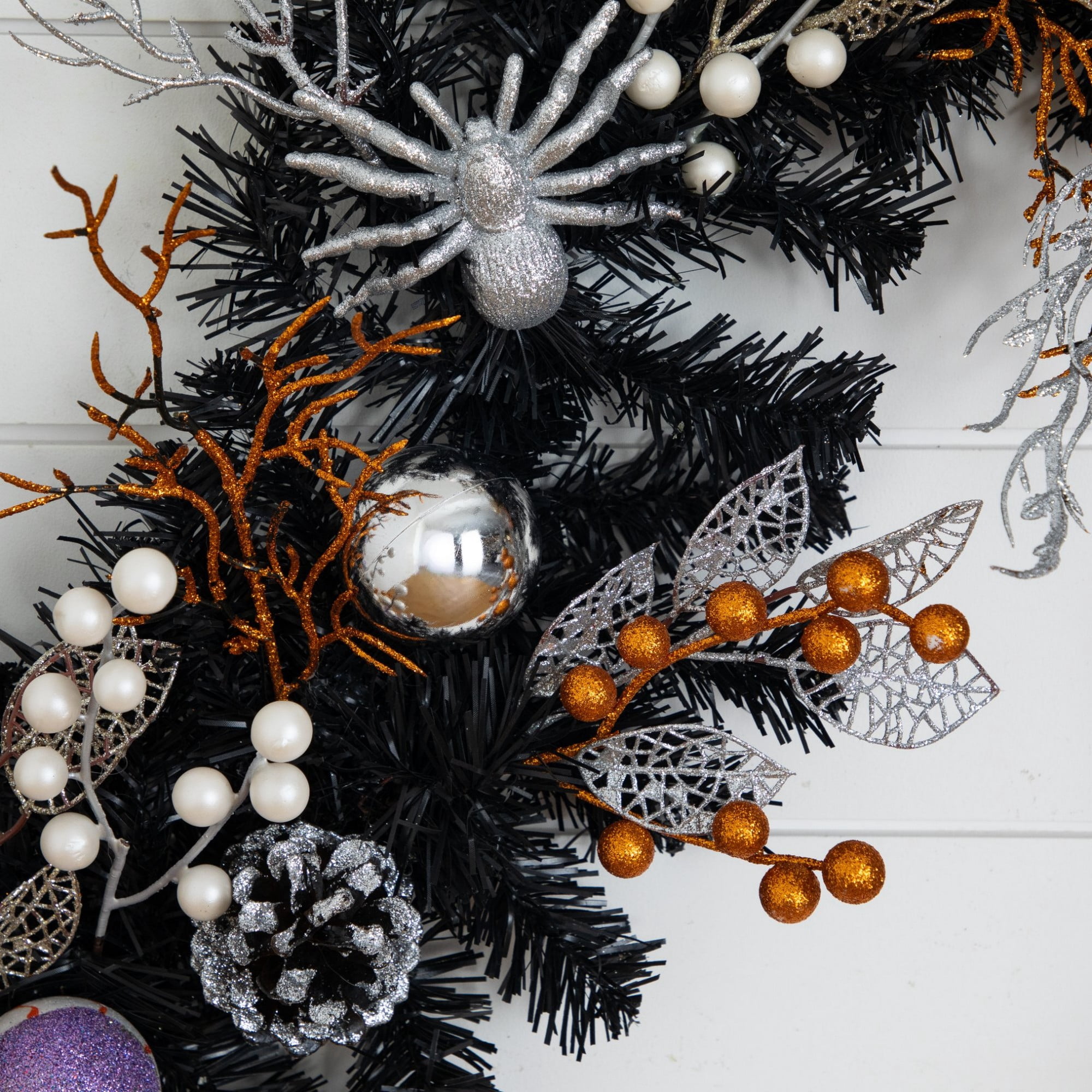 6ft. Artificial Halloween Black Garland with Skulls, Eyeballs and Spiders