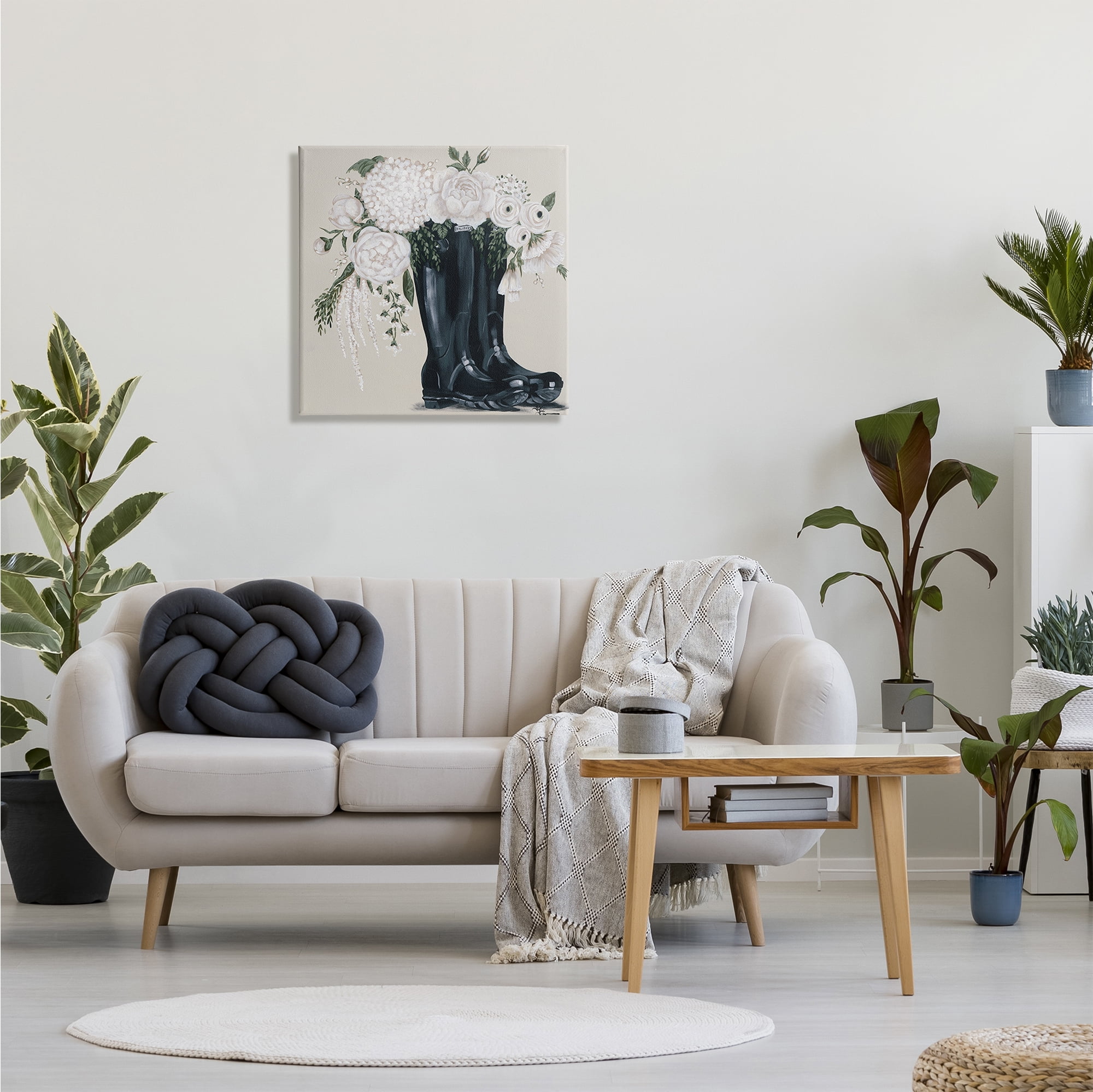 The Stupell Home Decor Collection White Flower Arrangement in Black Boots Painting Canvas Wall Art