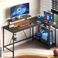 thumbnail image 1 of Bestier L Shaped Gaming Desk with LED Lights & Power Outlets, 58'' Reversible Computer Corner Desk with Shelves, Carbon Fiber Black Home Office Workstation with Monitor Stand & Headphone Hook, 1 of 7