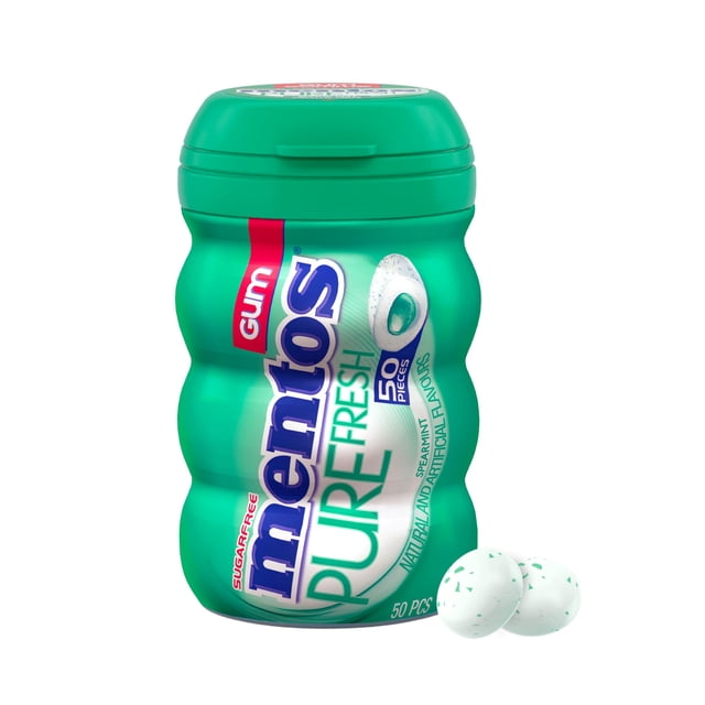 Mentos Pure Fresh Spearmint Sugar-Free Chewing Gum in a green curvy bottle with 50 pieces, featuring long-lasting spearmint flavor and sugar-free xylitol formula that may help reduce tooth decay, shown with three speckled white gum pieces.