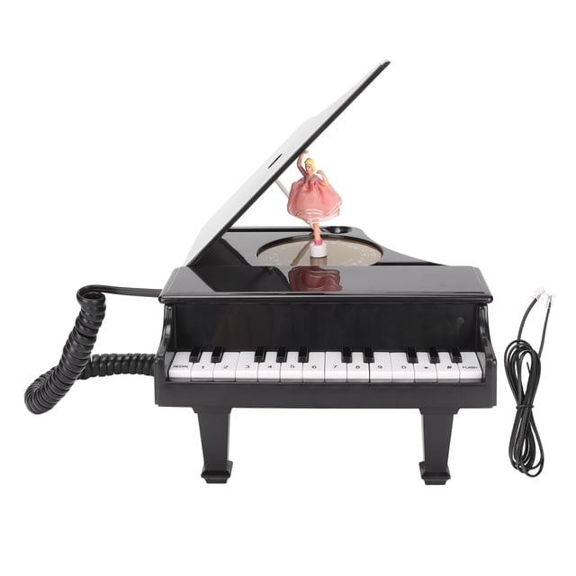 teléfono con cable estilo piano llamada hd teléfono fijo con cable con función de caja de música mini piano negro de escritorio, vista frontal; teclas físicas blancas y negras, auricular con cable enrollado a la izquierda, cable de línea a la derecha, tapa superior levantada con bailarina giratoria visible sobre la caja de música, carcasa ABS, adecuado también como adorno de escritorio en espacios pequeños.