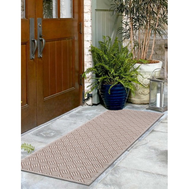 ECARPET Eve contemporary runner rug with beige geometric pattern displayed at an entranceway featuring wooden double doors, stone flooring, green potted plants, and decorative lantern.