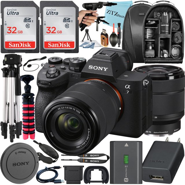Sony Alpha a7 IV Mirrorless Digital Camera with FE 28-70mm lens, accompanied by a ZeeTech accessory bundle. The bundle includes two SanDisk 32GB Ultra SDHC memory cards, a camera backpack, a full-size tripod, a spider tripod, a pistol grip tripod, a wrist hand strap grip, a high-speed memory card reader, and cleaning tools like a dust blower and microfiber cloth. The camera features a 33MP full-frame Exmor R CMOS sensor, 4K 60p video recording, 5-axis image stabilization, and real-time Eye AF. Additional accessories include a rechargeable battery, USB Type-C cable, and a deluxe starter kit.