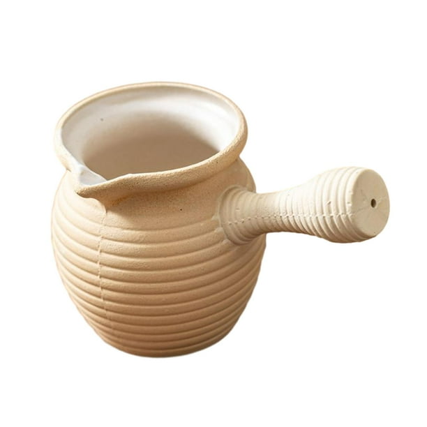 Tetera de cerámica con infusor de té para hervir agua en la cocina del hogar. 700ml Blanco