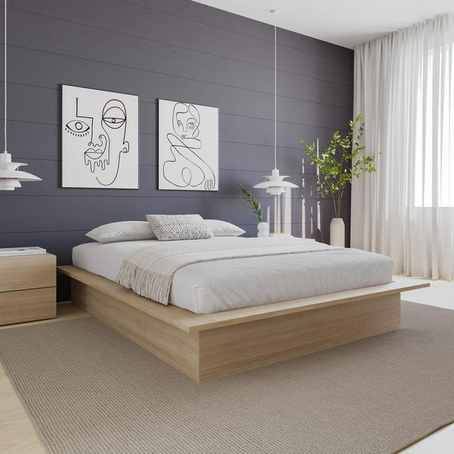 Nexera Malibu bed frame in light wood with white bedding in a modern bedroom setting featuring minimalist decor and abstract line art on the wall.