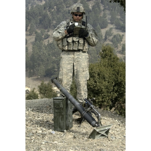 U.S. Army soldier gets information off of a lightweight handheld mortar ballistic computer