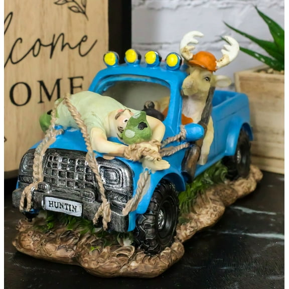 Buck Deer With Rifle In Blue Pick Up Truck With Tied Up Hunter On Hood Figurine