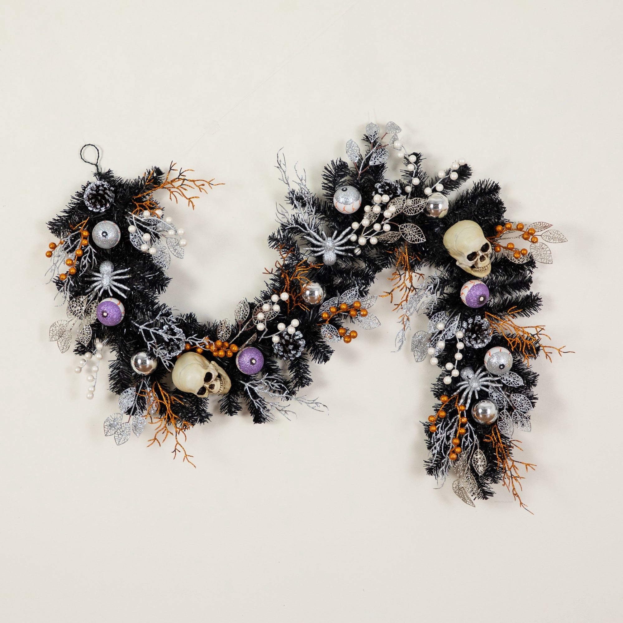 6ft. Artificial Halloween Black Garland with Skulls, Eyeballs and Spiders