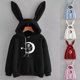 thumbnail image 1 of Mujer Hombre Casual Suelto Cordón Cráneo Luna Impresión Orejas De Conejo Sudadera Con Capucha Sudadera Top Jersey, 1 of 3