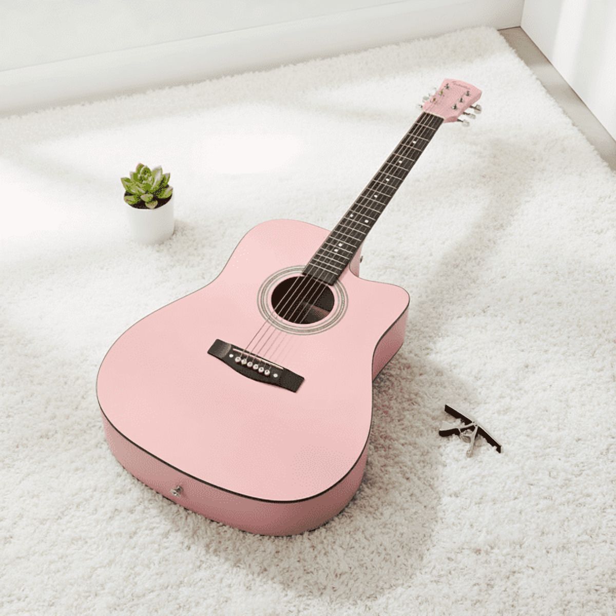 Pink 41-inch Dreadnought barrel-shaped cutaway acoustic guitar with pick, strings, capo, gig bag, tuner, wrench tool, and shoulder strap