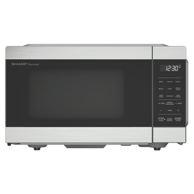 SHARP SMC0985KSC Carousel Countertop Convection Microwave Oven with Air Fry, featuring a 0.9 cu. ft. capacity and 900W power. This stainless steel 3-in-1 appliance combines microwave, oven, and air fryer functions. It includes a digital control panel with preset buttons for baking, roasting, air frying, and defrosting. The sleek design features a black glass door, LED display, and a 10.6-inch glass turntable. Accessories include a dishwasher-safe air fry basket and roasting pan.