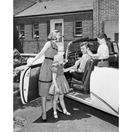 Mid adult woman and her daughter standing beside a car with a mid adult man and his son sitting in a car Canvas Art -  (24 x 36)