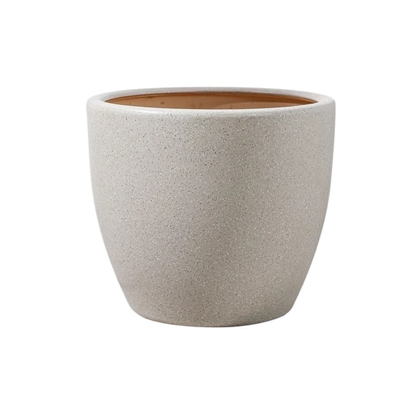 Maceta redonda marrón mate con orificios de drenaje for el patio y el jardín.