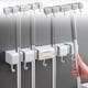 thumbnail image 1 of Estante organizador de fregonas y escobas montado en la pared | Soporte de plástico resistente | 4 ranuras de abrazadera ganchos móviles | Cocina, lavandería, garaje, almacenamiento de herramientas, 1 of 8