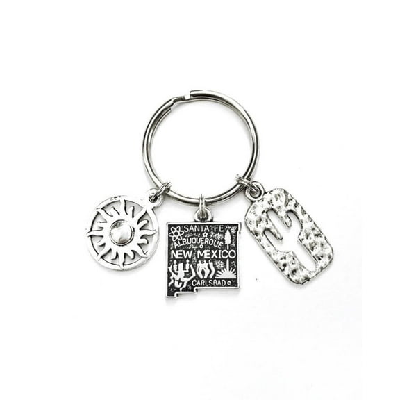 New Mexico themed keychain. Includes State of New Mexico, a Cactus, and Sunshine charms. Albuquerque, Santa Fe, Las Vegas Gift.