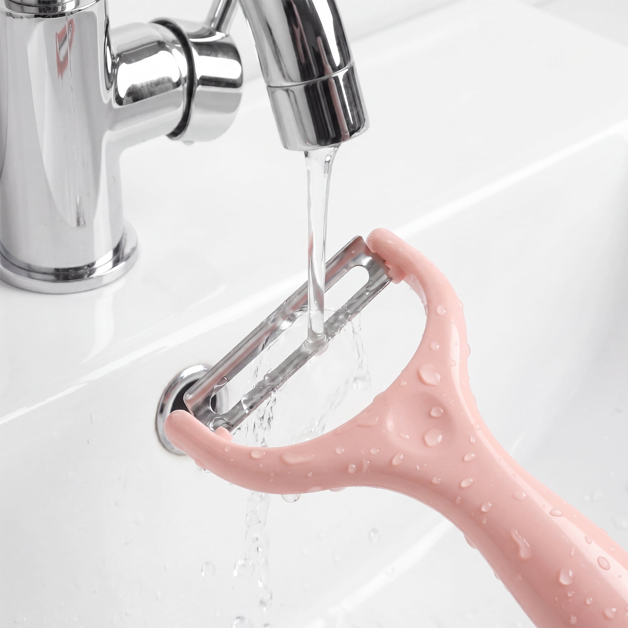 Unique Bargains Plastic Vegetable Peeler with Ergonomic Handle Light Pink 5.9x2.4x0.6 inch