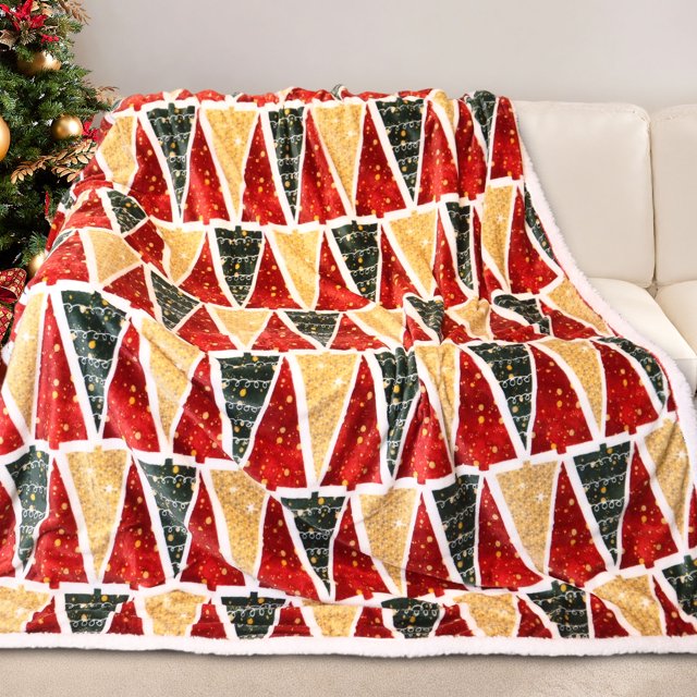 Gogreen Christmas Sherpa Fleece Twin Blanket for Couch Bed Sofa Adults, featuring a festive design with red, green, and gold Christmas trees. This soft and warm blanket is made from 220 GSM velvety flannel and 270 GSM Sherpa fleece, offering luxurious comfort and durability. The blanket is displayed draped over a white sofa, with a Christmas tree in the background, highlighting its holiday theme. Ideal for winter use, it is machine washable and suitable for beds, couches, or as a thoughtful gift.