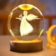 thumbnail image 2 of Luz nocturna de cristal 3D Decoración navideña Ángel Luz nocturna luminosa de cristal con luz LED Decoración Ángel Lámpara de cristal con base de madera, 2 of 8