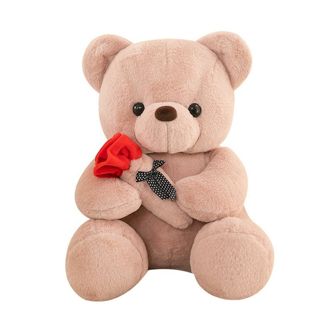 onlyliua para interior/exterior muñeca rosa para novia de san valentín, juguete, regalo de cumpleaños para niños — oso de peluche rosa sentado, pelaje terso, ojos negros y nariz marrón; sostiene una rosa roja de tela y una pajarita negra con puntos blancos. Vista frontal centrada sobre fondo blanco, opción de regalo para San Valentín o cumpleaños.