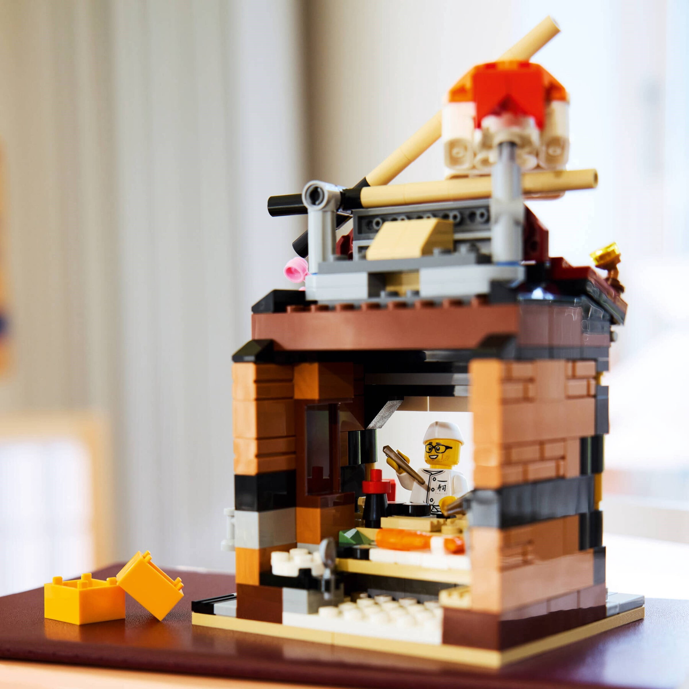 LEGO Restaurants of the World: Japan  289-Piece Japanese Restaurant Building Kit with Chef Minifigure, Sushi Decor Display Model, Collectible Gift for Teens  40906