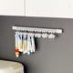 thumbnail image 1 of Estante de almacenamiento colgante de pared sin taladro con 20 clips, organizador de plástico blanco para baño, cocina, dormitorio, diseño ahorrador de espacio 30x1.5 cm., 1 of 6