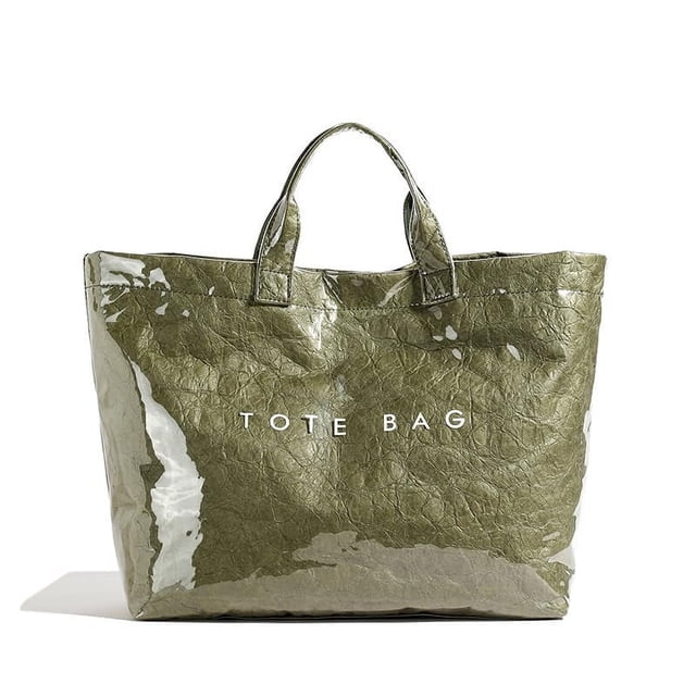 Bolsa de mano Lushandy de PVC para mujer, papel kraft con estampado de letras