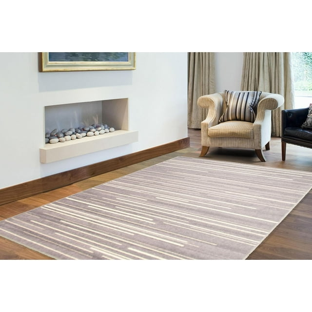 Minimalist striped area rug from ECARPET Fika Collection placed on wooden floor near beige armchair and modern fireplace.