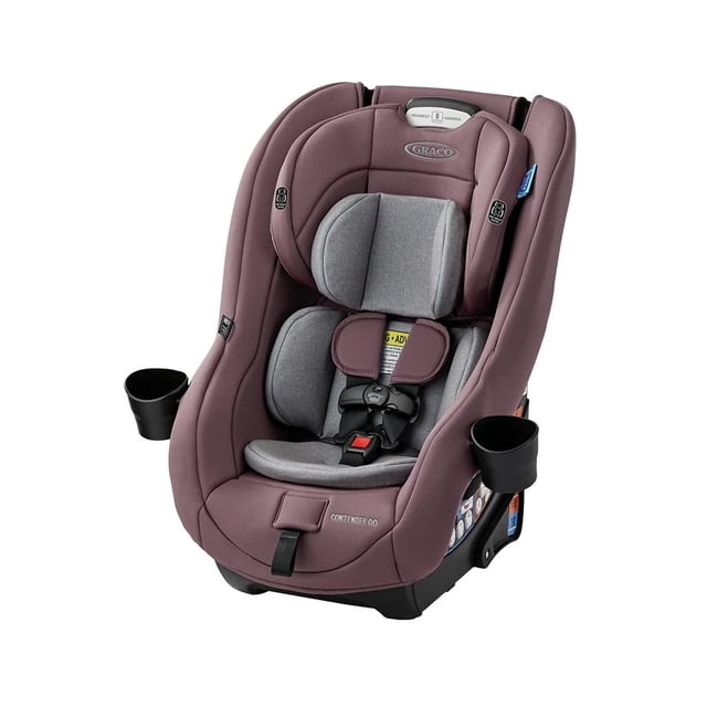 autoasiento convertible graco c-go sara gris reclinable, vista frontal 3/4 de asiento infantil gris y malva con arnés de 5 puntos y reposacabezas ajustable, cojín reductor interior, 8 posiciones de altura, reclinación de 2 posiciones, dos portavasos removibles, base compacta con indicador de nivel y acolchado EPS visible; su tamaño compacto lo hace adecuado también para viajes con espacio limitado.
