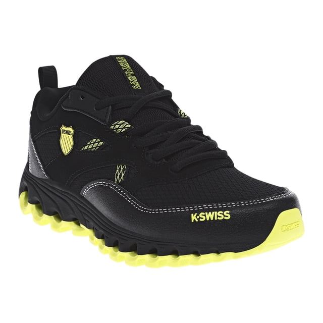 tenis kswiss tubes trial 200 hombre negro K-Swiss — vista 3/4 frontal de tenis negro con suela y detalles amarillo neón, aplicación tipo gamuza en franja y talón, costuras visibles, escudo en lengüeta, ojales metálicos y logo K-SWISS en puntera; plantilla con Cushion confort, adecuado para uso diario y actividades casuales.