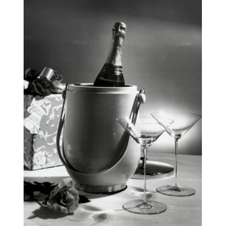 - Champagne bottle in an ice bucket with two empty martini glasses beside it Canvas Art - (24 x 36)