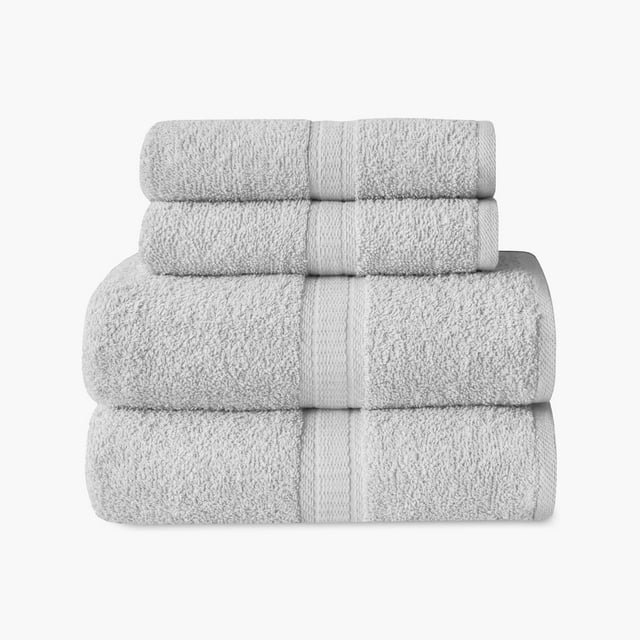 Set of four grey Mainstays Basics towels including 2 bath towels and 2 hand towels neatly stacked.