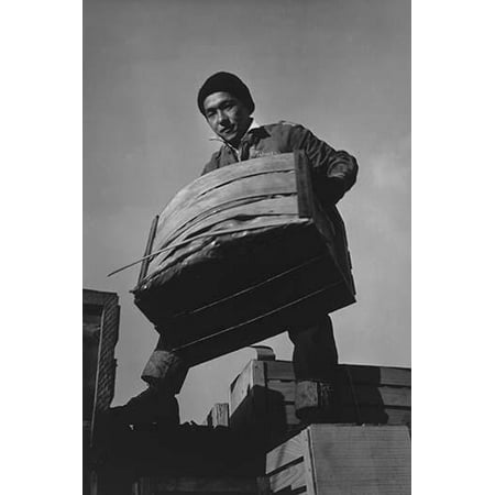 Tsutomu Fuhunago lifts a produce crate while standing on top of a load of crates  Ansel Easton Adams was an American photographer best known for his black-and-white photographs of the American West  (Best Of Ansel Adams)