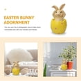 thumbnail image 5 of El Conejo de Pascua se sienta en la cáscara del huevo y no escucha, mira ni habla sobre la decoración de la mesa. MFZFUKR BST3012460-1, 5 of 5