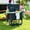 Black, variant on Demi Bonn 33" Outdoor Cooler Cart with 104-Quart Capacity, Bottle Opener, Shelves & Wheels, Rolling Ice Chest for All Seasons, Black