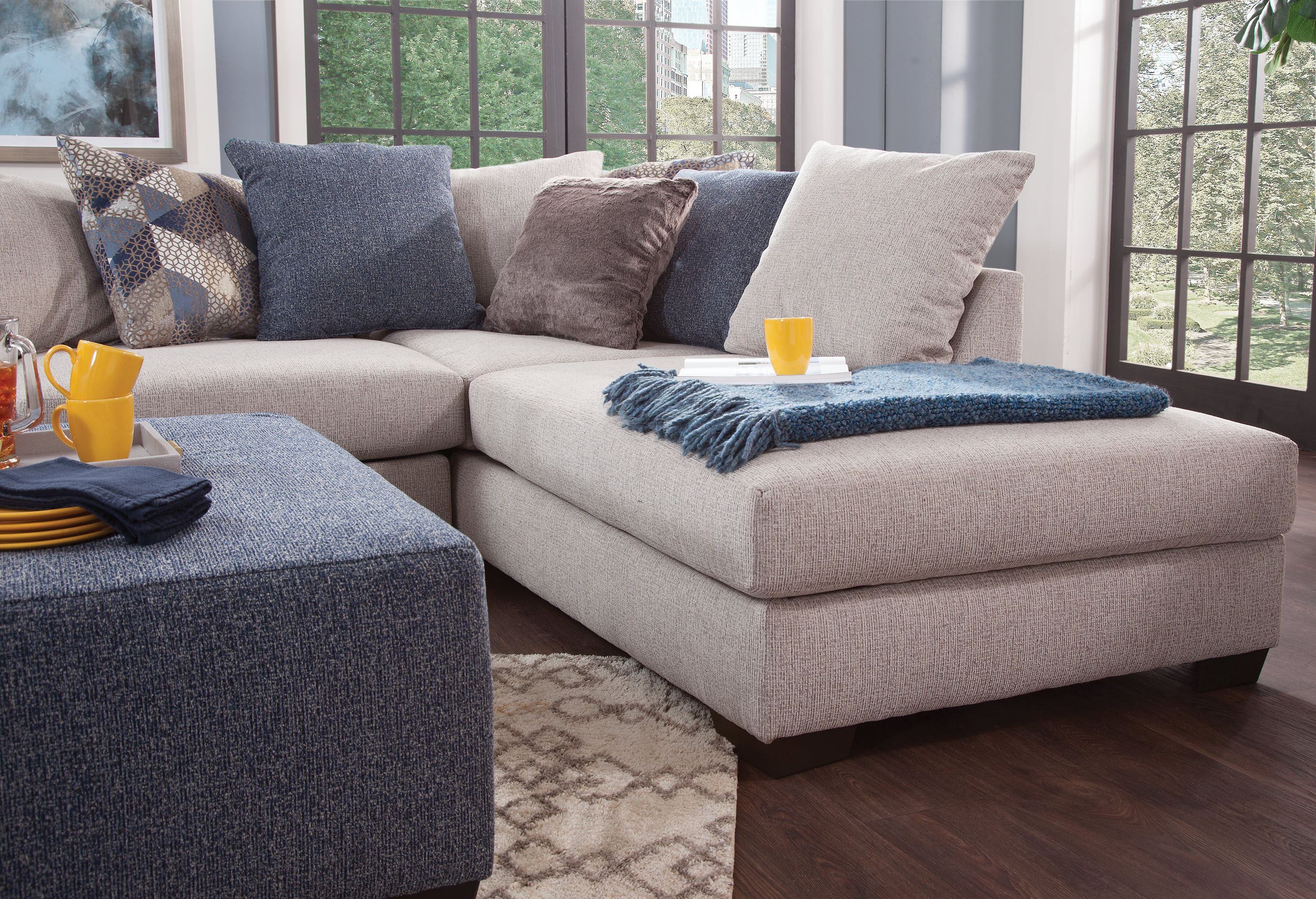 American Furniture L Shaped Sectional Sofa with 9 Loose Back Pillows and 2 Accent Pillows