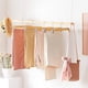 thumbnail image 2 of Juego de 12 Perchas de Madera para Pantalones, Perchas para Pantalones con Clips de Metal Ajustables, Gancho Giratorio 360°, para Pantalones, Faldas, 34 x 1,2 x 12,5 cm, Natural, 2 of 9